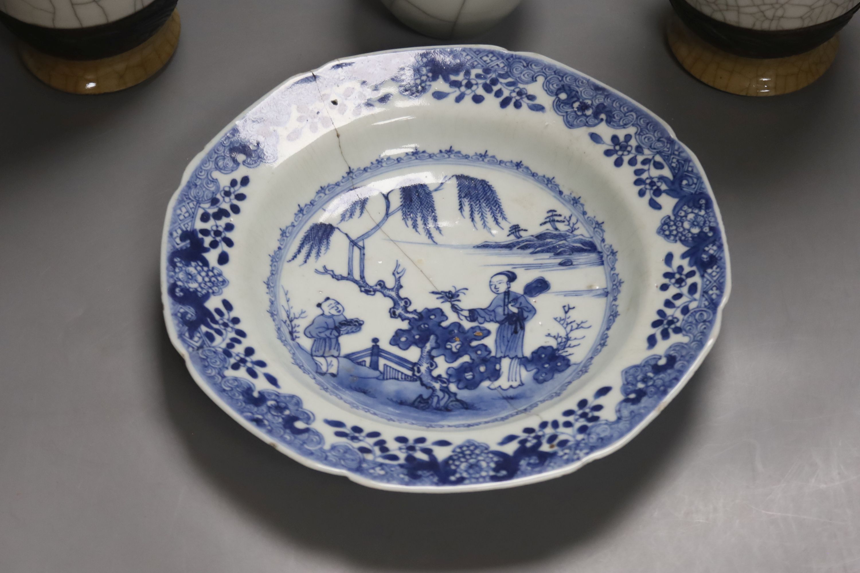 A late 19th century Chinese blue and white dish, together with a pair of crackle glaze vases and another, tallest 25cm